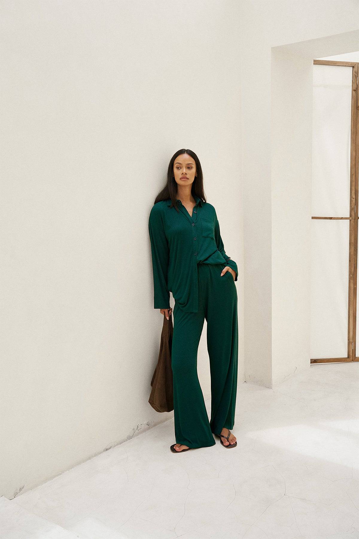 Riot Lounge Rory wide leg pant in forest green with soft ribbed fabric, stylish and comfortable apparel bottoms.